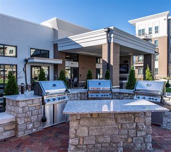 Outdoor Kitchen and Gaming Lawn at One Deerfield Apartments, Mason, OH, 45040